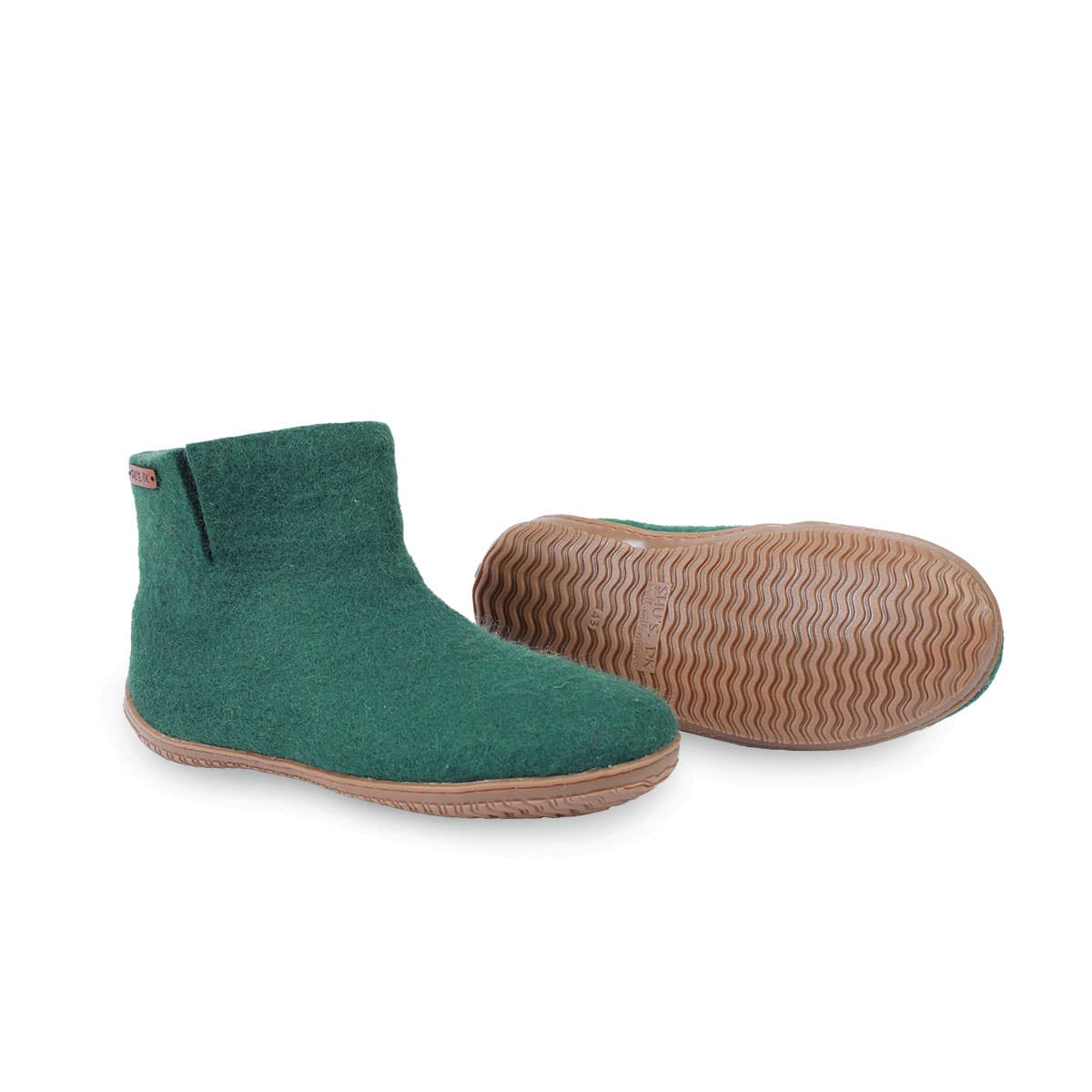 Håndlavede grønne uld hjemmesko fra Shus.dk, lavet af 100% New Zealandsk uld, sikrer varme og komfort. Med natur gummisål og høj skaft. Dansk design.